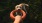 a man holding a ring in front of a dog